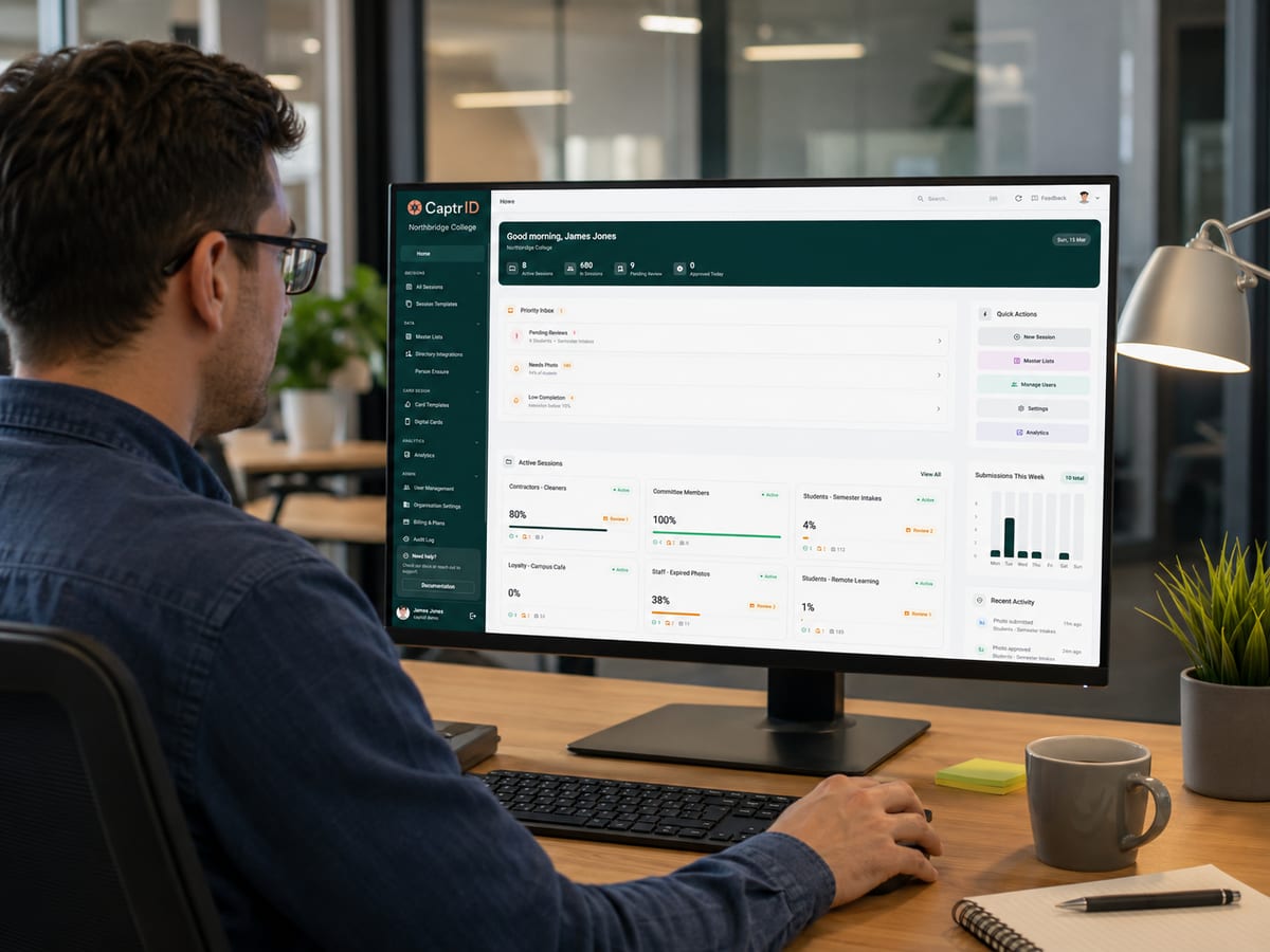 An administrator managing staff IDs in the CaptrID admin dashboard on a desktop monitor