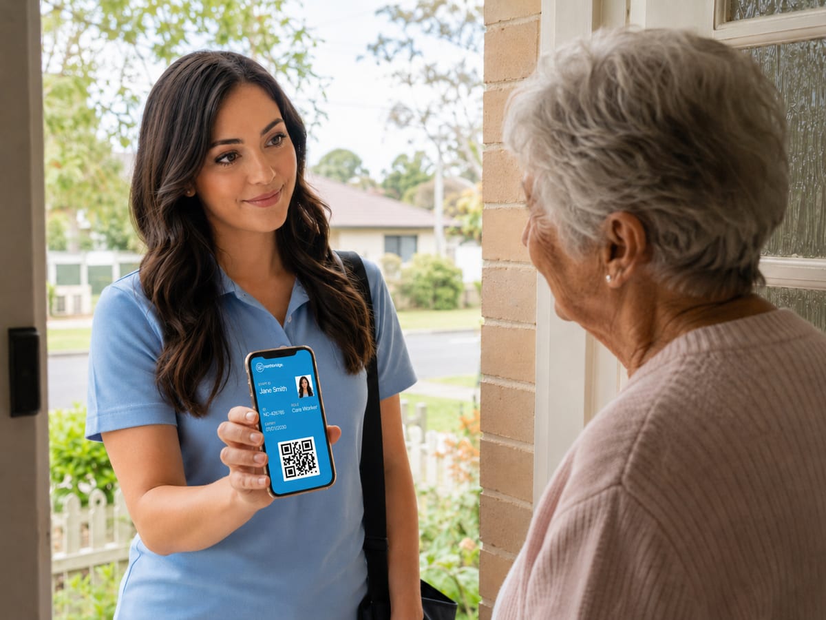 A support worker showing her digital ID at an elderly client's front door